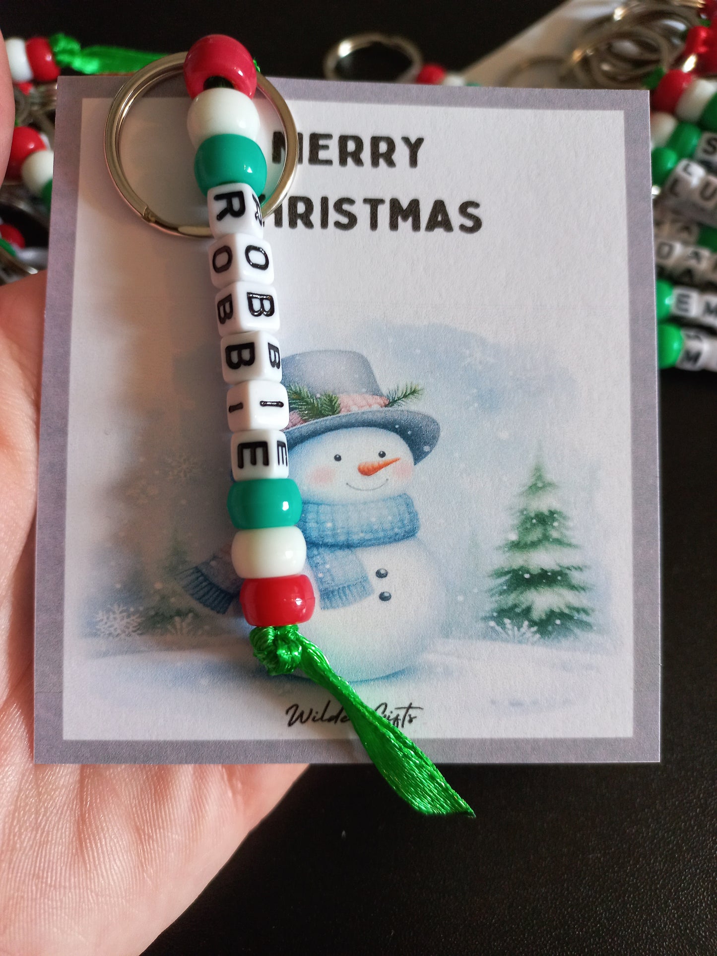 Personalised beaded Christmas keyring with a Snowman backing card.