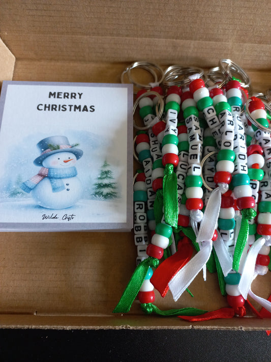 Personalised beaded Christmas keyring with a Snowman backing card.